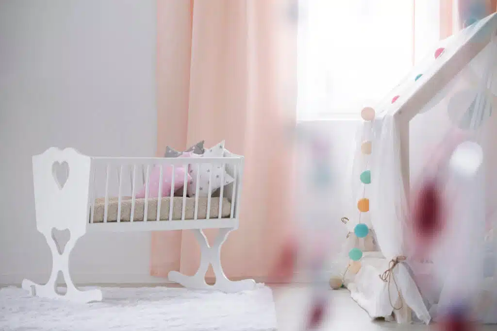 White crib in modern cozy baby room