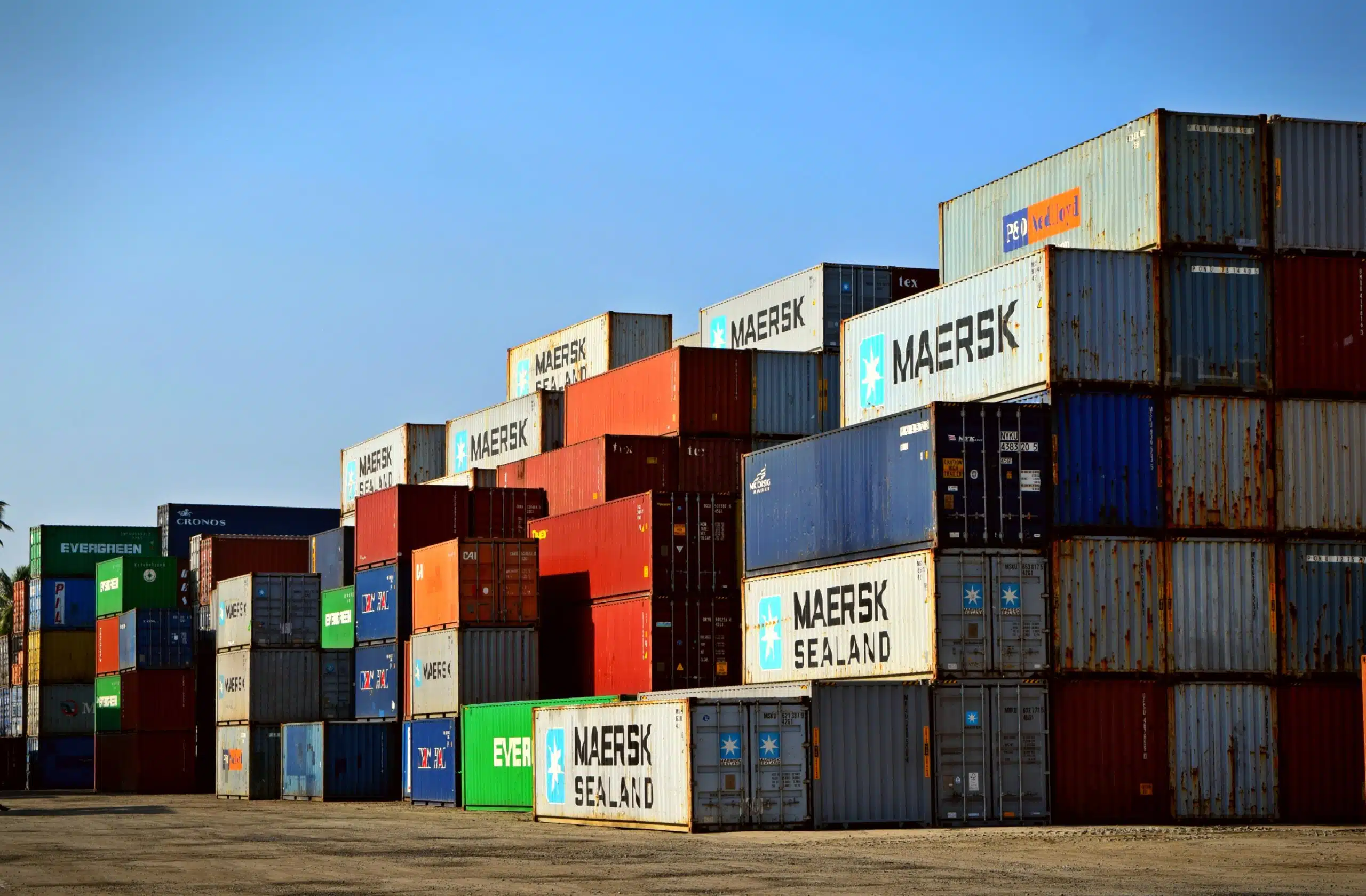 zoom imaged of colorful containers with incoterms for exportation and importation