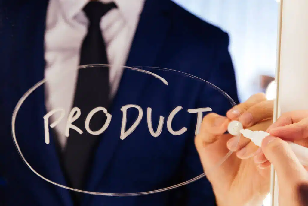 Smart business man writing the word Product on the mirror board - Product text calculate the cost of private label production