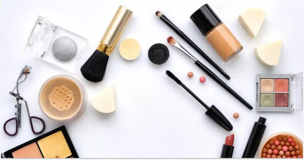 Female beauty blogger tests cosmetics at home holds eyeshadow palette shares impressions with followers gives recommendations how to do makeup films process on smartphone webcam for viewers.