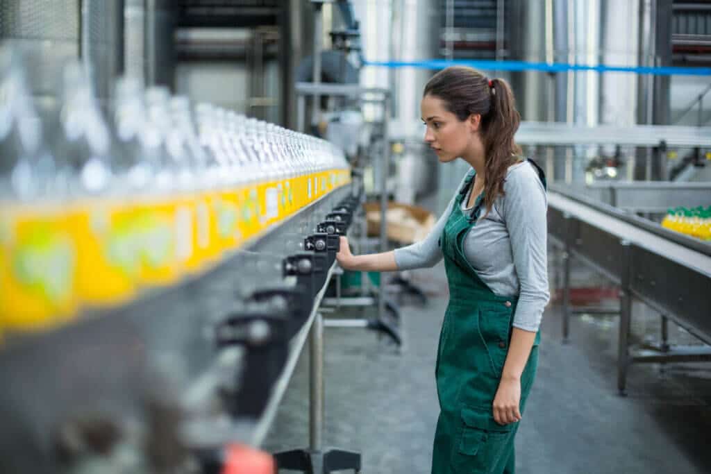 female factory worker standing near production lin 2021 08 28 16 49 36 utc