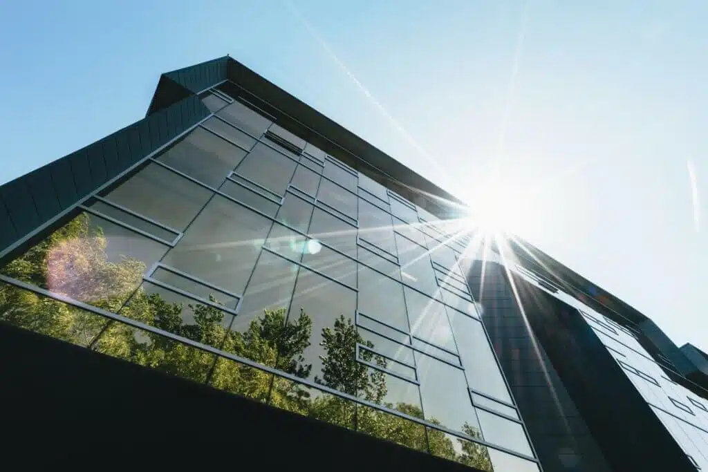 a green office building in the sun, perfect for your private label business as it is more eco-friendly, sustainable and environmentally friendly