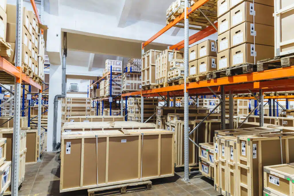 Logistic, industry, shipment, storage and manufacturing concept. Cargo boxes on shelves in warehouse. Industrial goods. Large long racks to launch a new consumer product