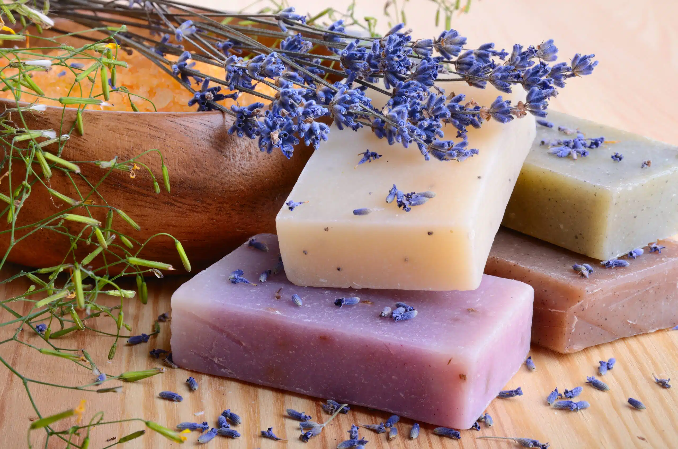 Natural handmade body care soaps with salt and lavender flowers