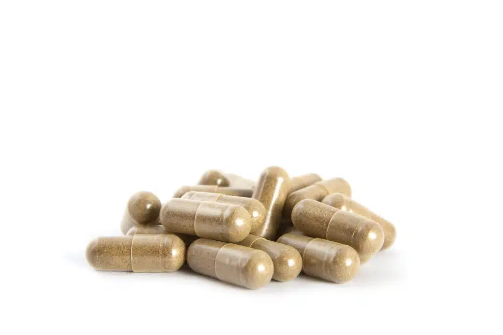 A heap of collagen boost supplement pills. A polypeptide molecule, collagen is a protein in our bodies.