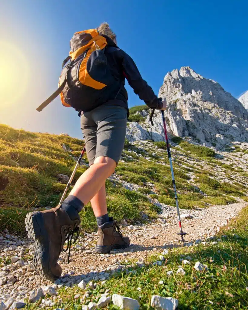 Hiker traversing a picturesque trail, exemplifying the spirit of outdoor adventure and the use of high-quality adventure gear.