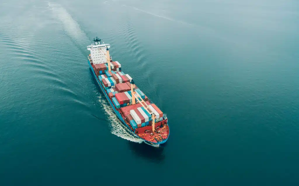Aerial view of Cargo ship sailing in open sea