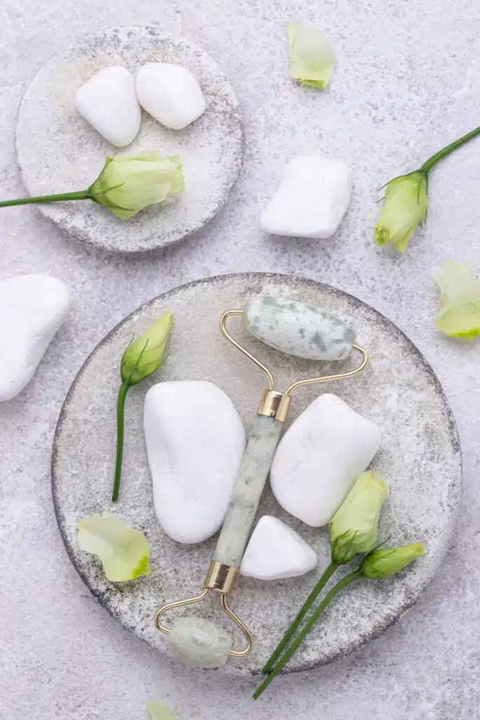 Green jade facial roller for massaging and skincare