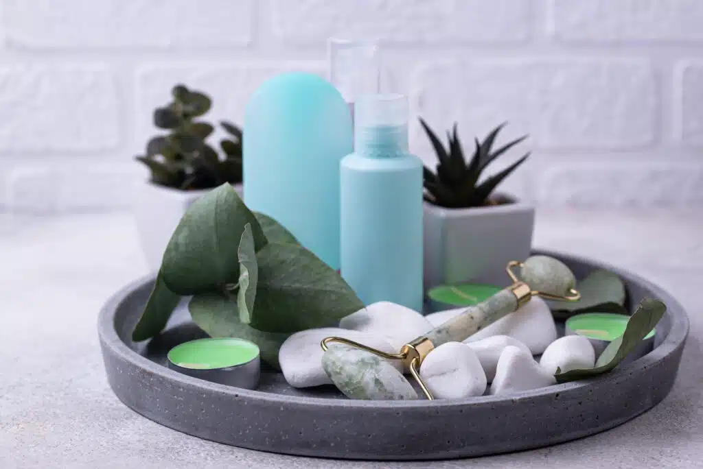 Green jade facial roller for massaging and skincare