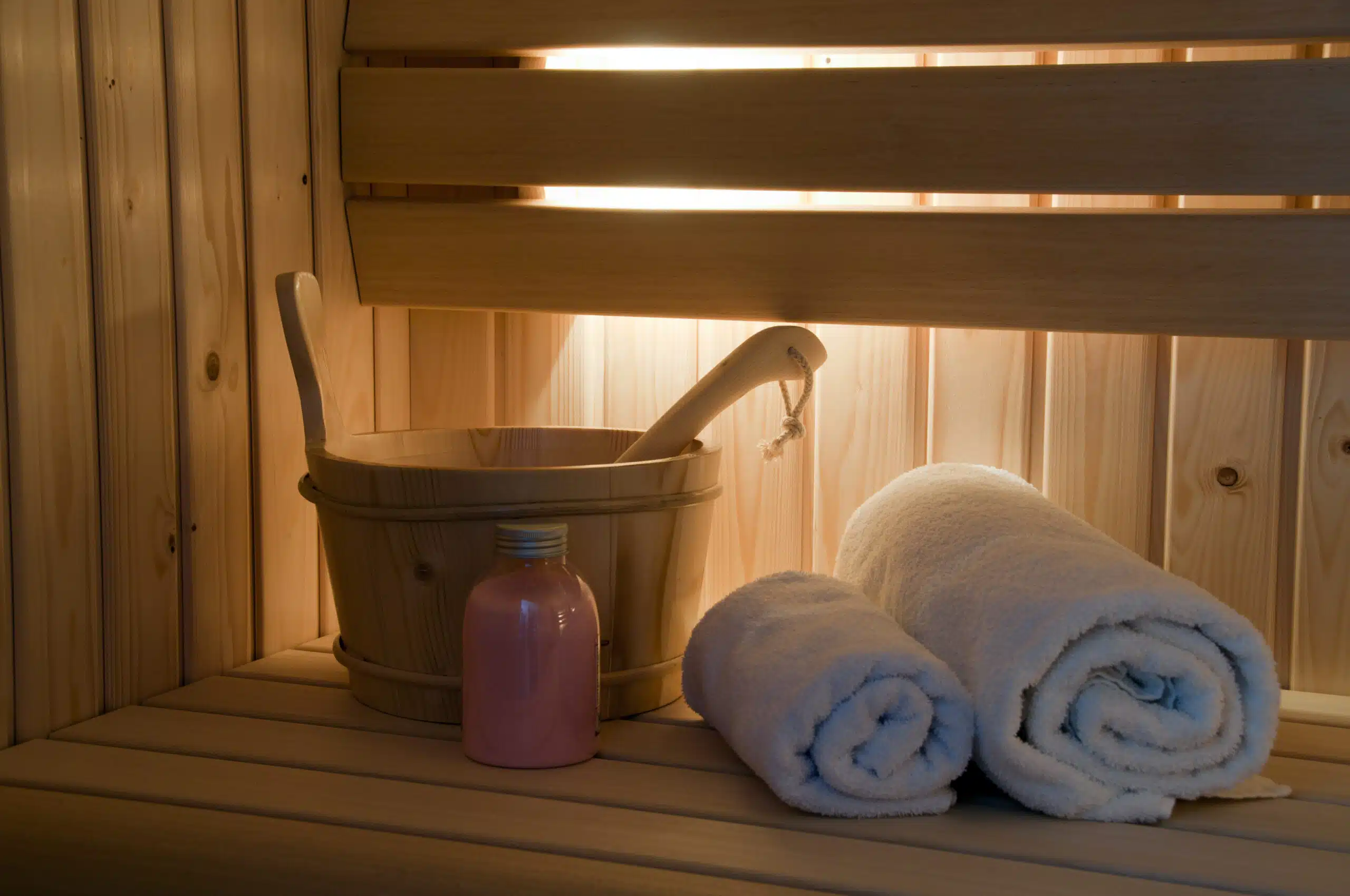 sauna interior with light and towel and scrub