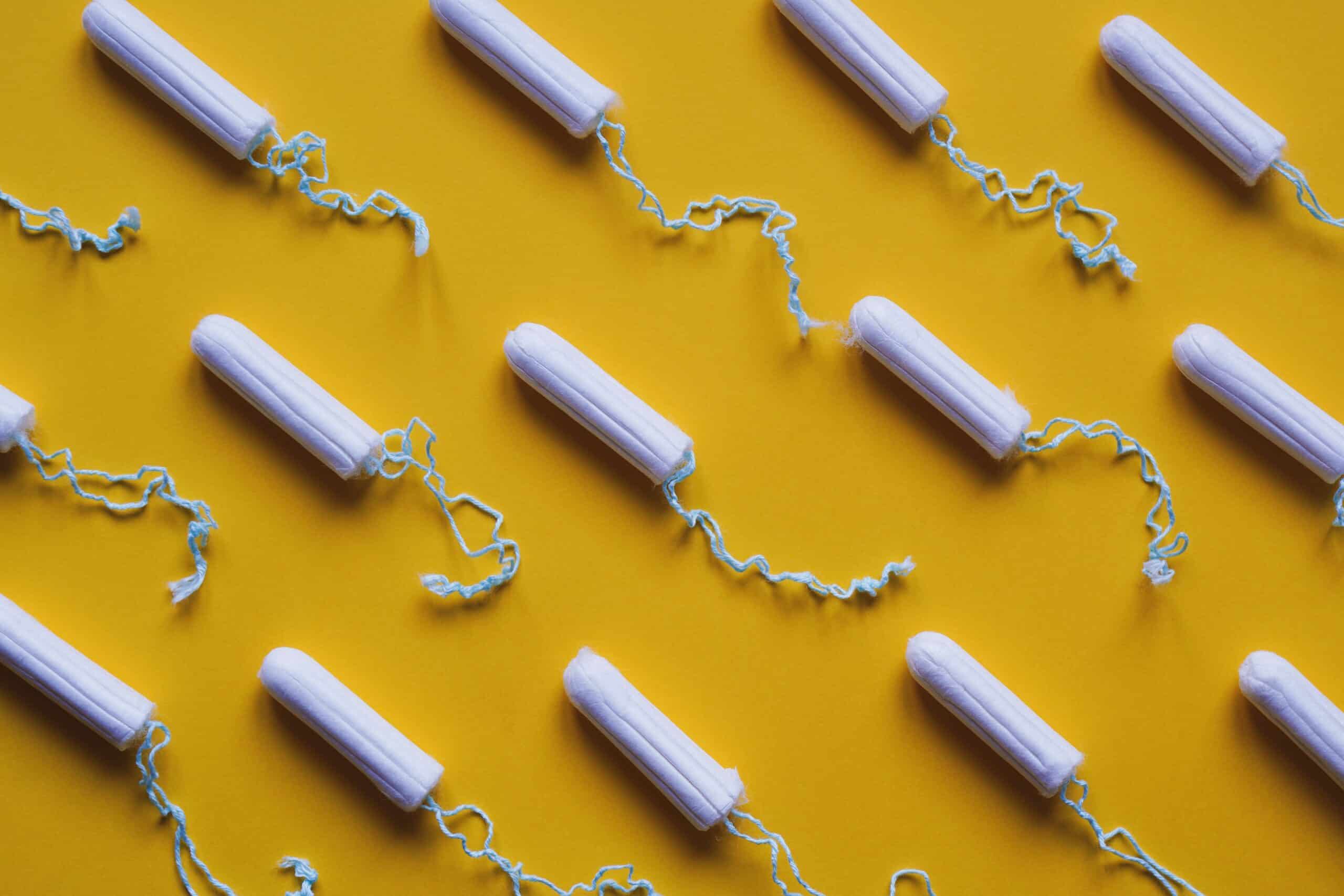 tampon flat lay - many tampons arrangement in rows - period or menstruation concept