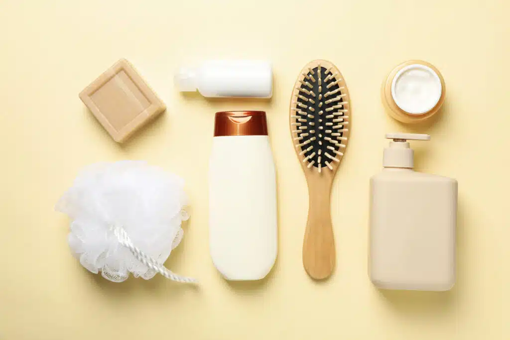Flat lay with hygiene concept on beige background, top view