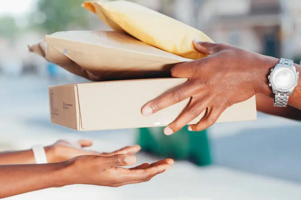 A deliveryman delivering packages with ordered products.
