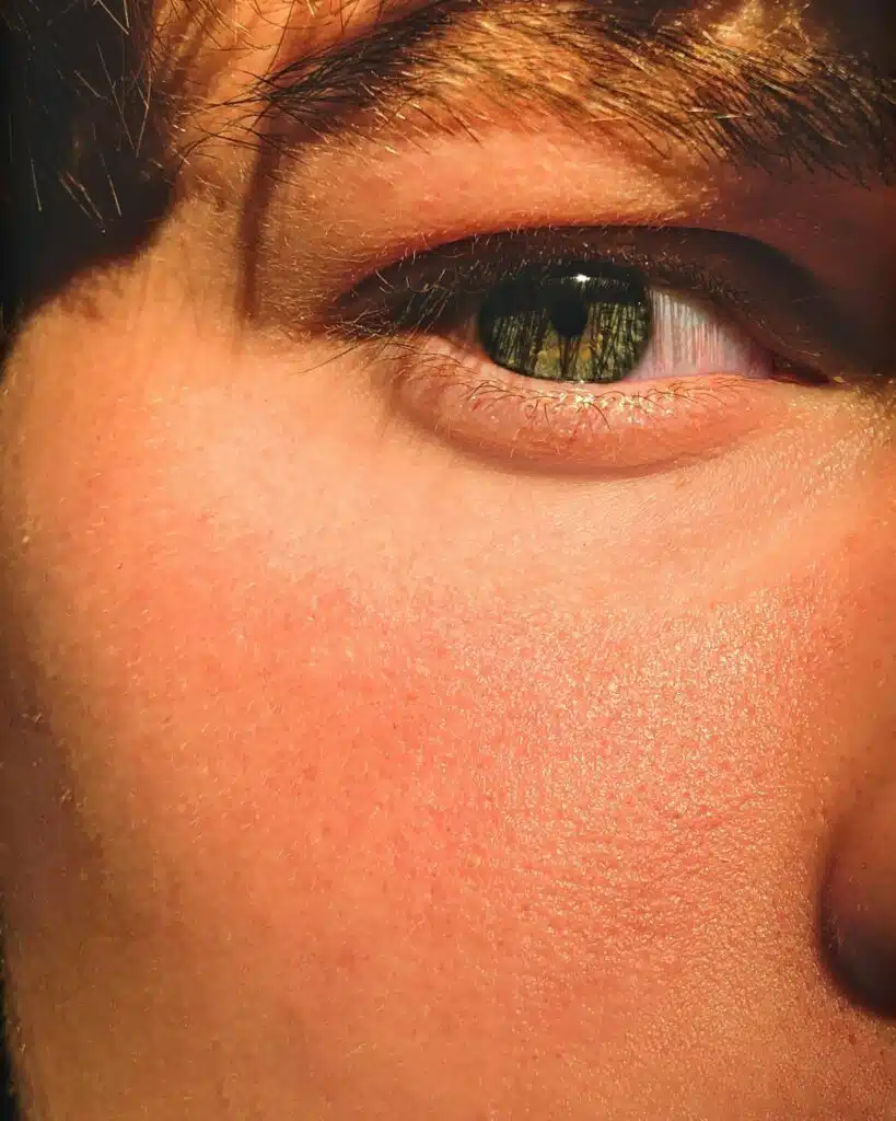 Man with striking green eyes that capture attention and exude depth.